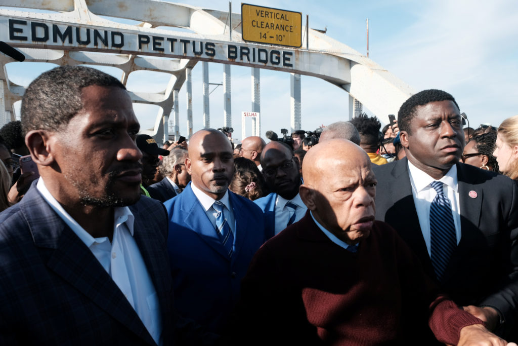 Late Congressman John Lewis crosses the Edmund Pettus Bridge with other leaders of the Civil Rights Movement leaders, commemorating the 55th anniversary of the "Bloody Sunday" march in Selma, Alabama, on March 1, 2020.