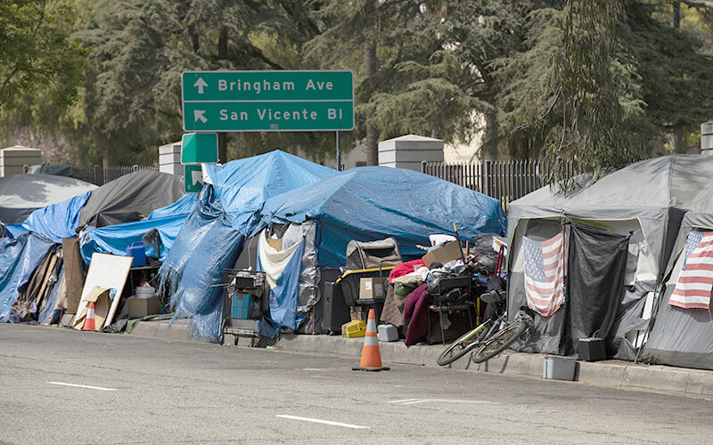 A homeless encampment sits on a street in Downtown Los Angeles, California, USA.