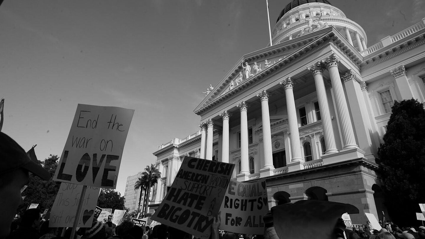 Black and white photo of of a gay marriage demonstration at the California state capital.