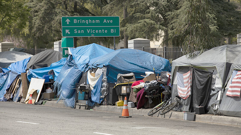 A homeless encampment sits on a street in Downtown Los Angeles, California, USA.