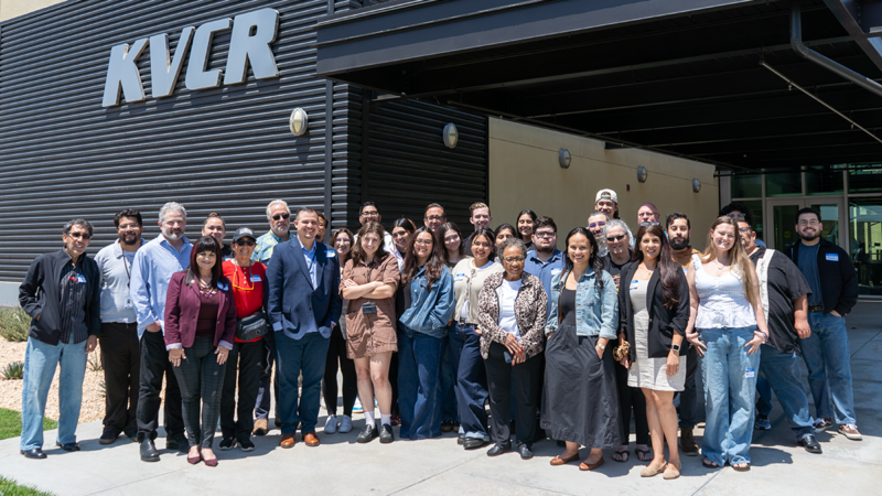 Group photo of approximately workshop participants in front of KVCR building.