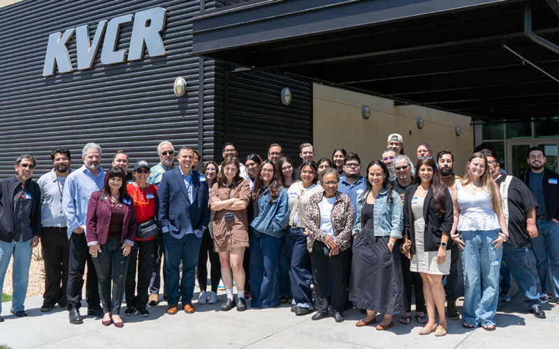 Group photo of approximately workshop participants in front of KVCR building.